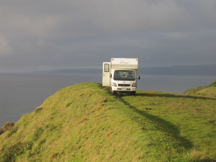On a hill by the sea