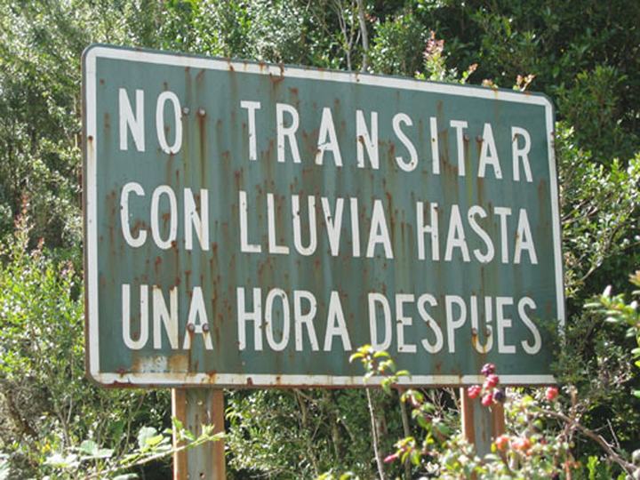 Sign: don't drive until one hour after rain