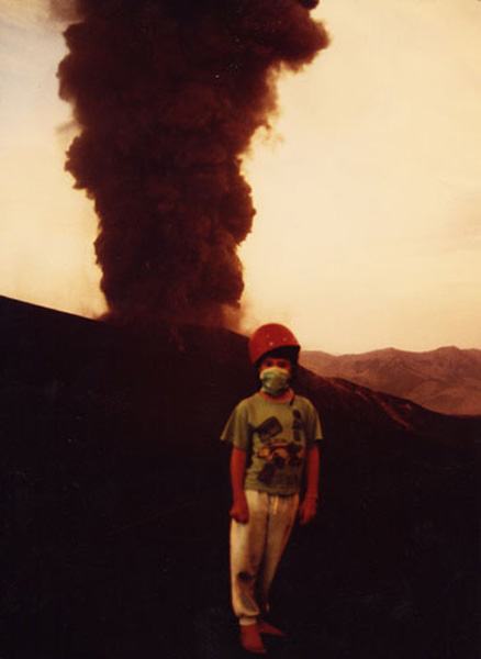 Cristian with helmet, barefoot, and Navidad volcano